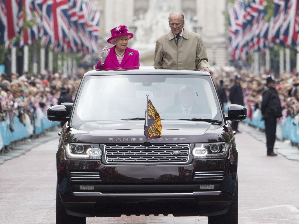 The Queen and Duke of Edinburgh wave to guests attending “The Patron’s Lunch” celebrations for the Queen’s 90th birthday on The Mall on June 12, 2016. Prince Philip once said: “My job first, second and last is never to let the Queen down.” It’s a partnership Prince Harry acknowledged in a 2012 interview: “Regardless of whether my grandfather seems to be doing his own thing, sort of wandering off like a fish down the river, the fact that he’s there – I don’t think that she could do it without him.” Prince Philip died, aged 99, on April 9, 2021. Picture: Getty