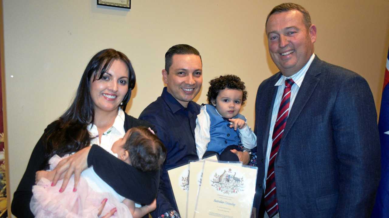 NEW AUSTRALIANS: Mayor Tyson Golder stands with Luz Perez and Cesar Sabogal and their children, Alana and Matias, at the Roma citizenship ceremony. Picture: Joshua Macree