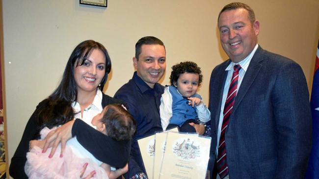 NEW AUSTRALIANS: Mayor Tyson Golder stands with Luz Perez and Cesar Sabogal and their children, Alana and Matias, at the Roma citizenship ceremony. Picture: Joshua Macree