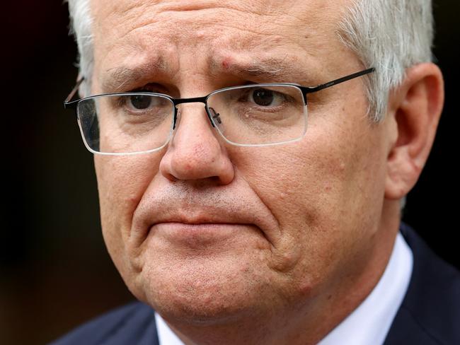 SYDNEY, AUSTRALIA - OCTOBER 15: Australian Prime Minister Scott Morrison speaks during a media conference on October 15, 2021 in Sydney, Australia. Prime Minister Scott Morrison has responded to the NSW government's announcement they would lift passenger caps and remove quarantine requirements for vaccinated international travellers from 1 November 2021. The Prime Minister clarified the rules would only apply to Australian citizens, residents and their immediate families. In the same press conference, Prime Minister Scott Morrison also confirmed he would attend 2021 United Nations Climate Change Conference in Glasgow. (Photo by Brendon Thorne/Getty Images)