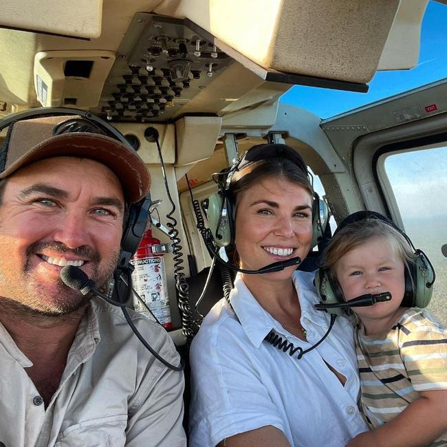 Matt Wright flying in a helicopter with his wife Kaia and son Banjo.