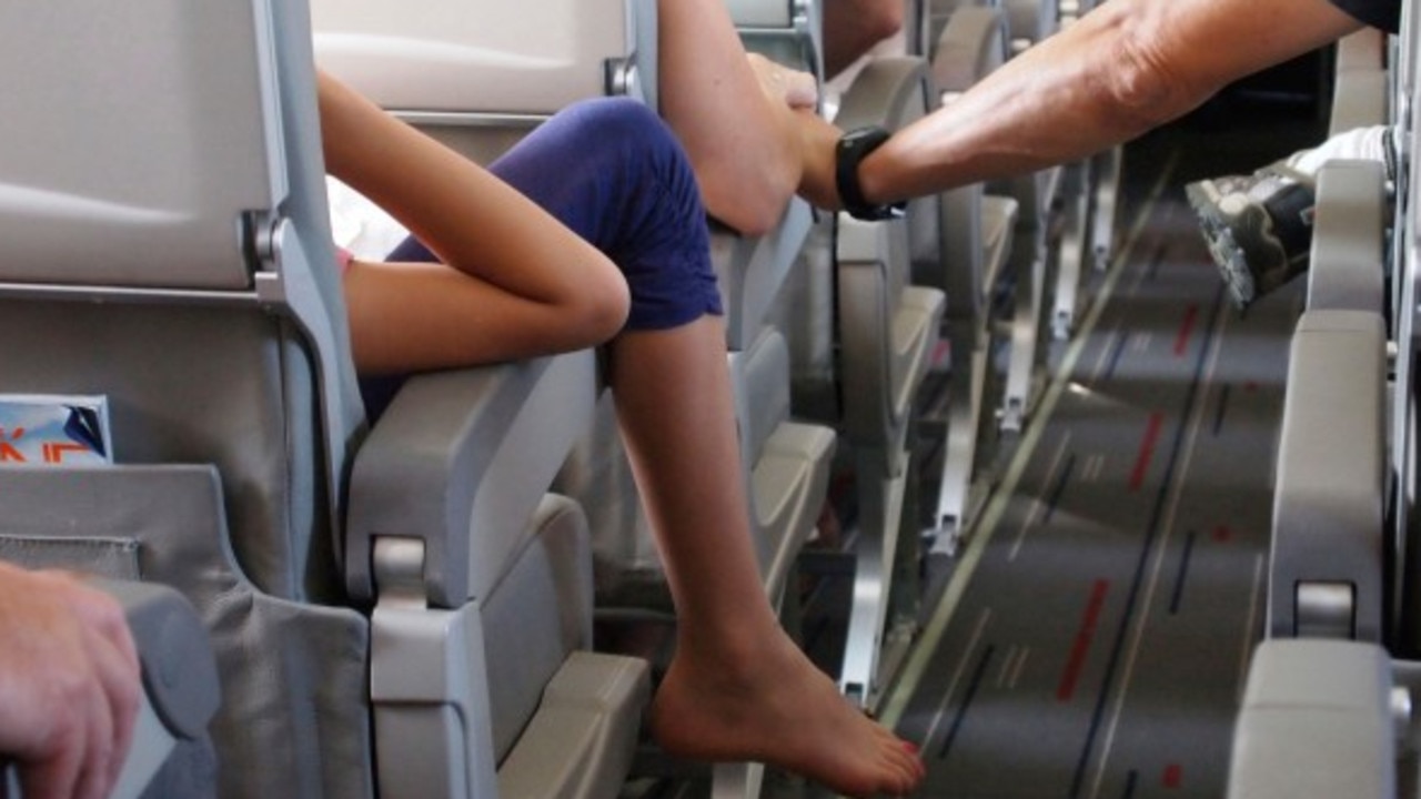 A disgusted passenger was unlucky enough to spot some rather grubby feet beneath them during a flight