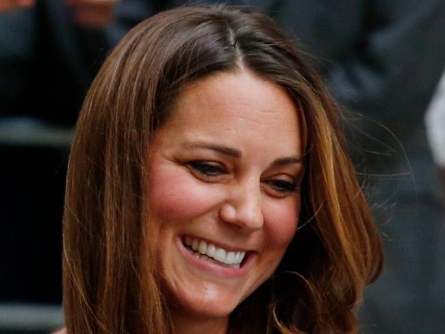 TO GO WITH AFP STORY BY KATHERINE HADDON (FILES) In a file picture taken on July 23, 2013 Britain's Prince William and Catherine, Duchess of Cambridge show their new-born baby boy, Prince George of Cambridge, to the world's media outside the Lindo Wing of St Mary's Hospital in London. When Prince William and his wife Kate emerge from hospital cradling Britain's new royal baby, expect April 2015, for the cameras, the picture will be on the front of newspapers worldwide. But don't expect many photographs after that. The second in line to the throne and his wife have fought hard for the right to bring up their family in private, despite being one of the most famous couples in the world. AFP PHOTO / ANDREW COWIE