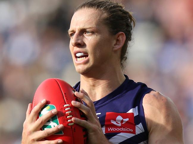 PERTH, AUSTRALIA - MAY 27: Nathan Fyfe of the Dockers looks to pass the ball during the round 10 AFL match between the Fremantle Dockers and the North Melbourne Kangaroos at Optus Stadium on May 27, 2018 in Perth, Australia.  (Photo by Paul Kane/Getty Images)