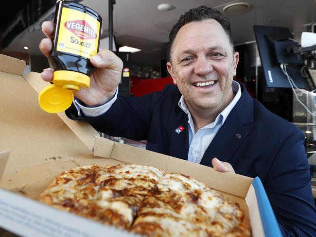 Dominos Australia and New Zealand CEO David Burness with their Cheesy Vegemite pizza. Picture: Josh Woning