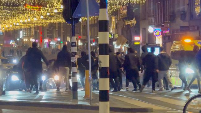 Israeli football supporters and Dutch youth clash near Amsterdam central station, in Amsterdam in November. Above is a still image obtained from a social media video. Picture: X/iAnnet/via Reuters