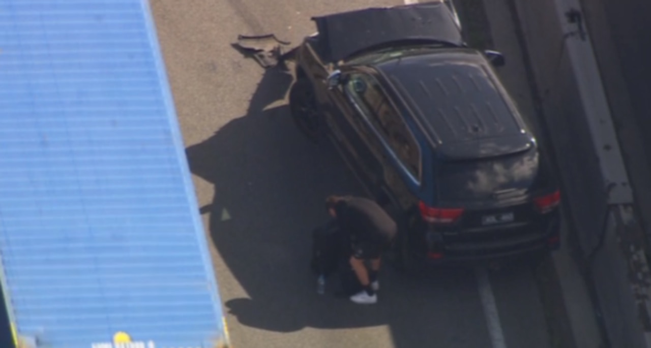 Josh Carmichael with the car after the crash. Picture: Channel 7