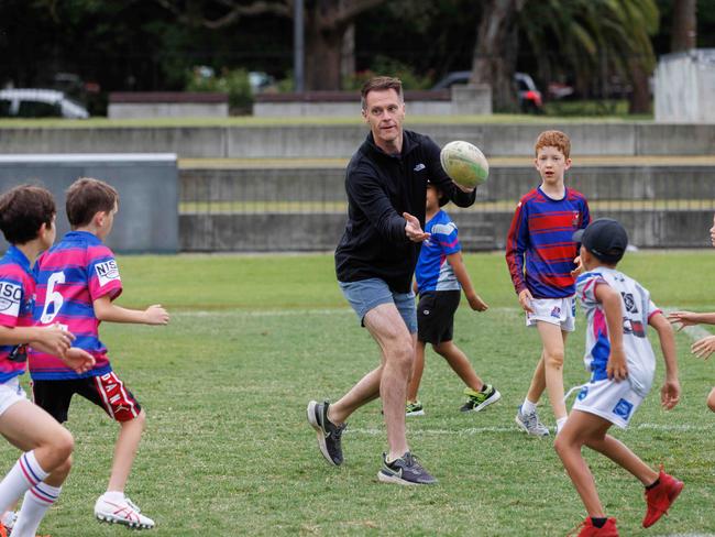 DAILY TELEGRAPH, MARCH 21, 2023.EMBARGO DT PIC DESKNSW Labor Leader Chris Minns met with NRL star Latrell Michell at Redfern Oval to pledge funding for Far West Rugby League. They had a run around with some local kids. Picture: David Swift