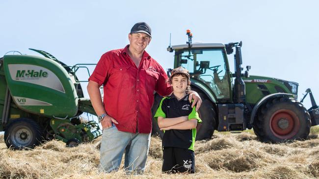 Hay and silage contractor Aaron Daniel and son Joe, 9 pictured baling hay. Picture: Zoe Phillips