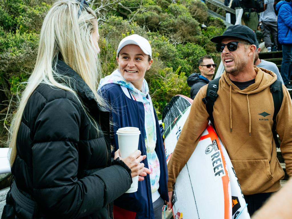 Ash Barty (centre) spends time with three-time world surfing champion Mick Fanning at Bells Beach. Picture: Aaron Hughes/World Surf League