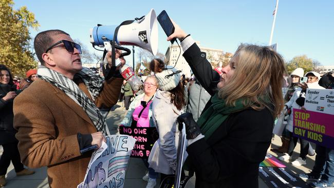 Transgender rights supporters and opponent argue with each other at a rally outside the US Supreme Court as the high court hears arguments in a case on transgender health rights last December. Picture: Kevin Dietsch / Getty Images via AFP)