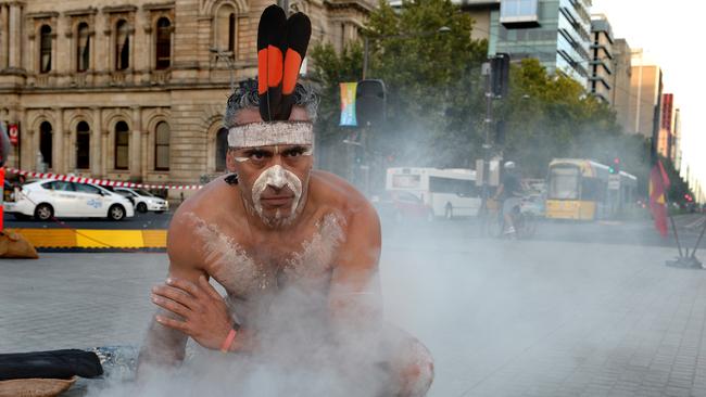Karl Winda Telfer doing a Kaurna Palti Meyunna smoking ceremony for the fringe festival in Victoria Square. Picture: Campbell Brodie
