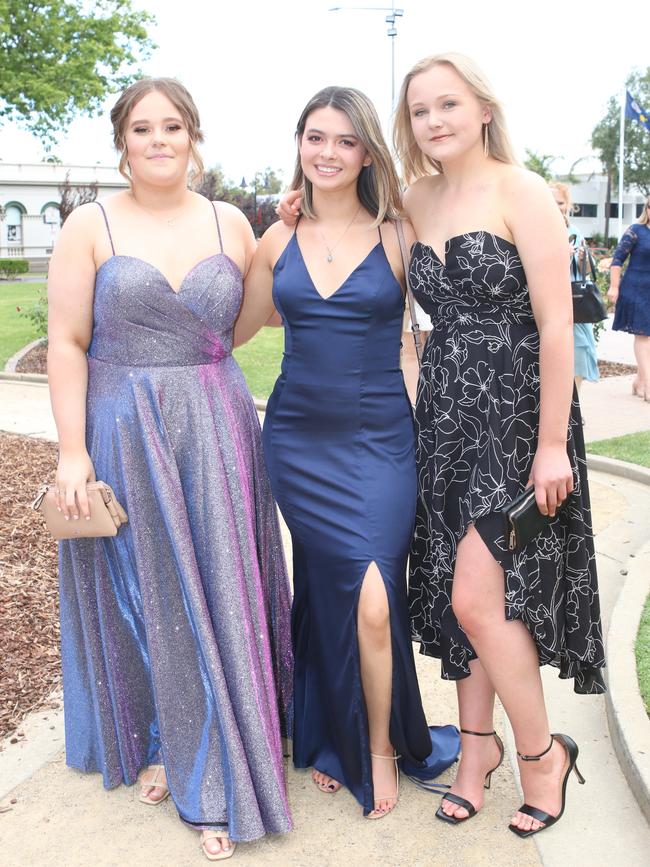 Ella Leonard, Gabby Allen and Courtney Barron celebrating the end of high school.