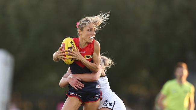 Melbourne’s Eliza McNamara taking on Carlton at Casey Fields. Photo by Michael Klein