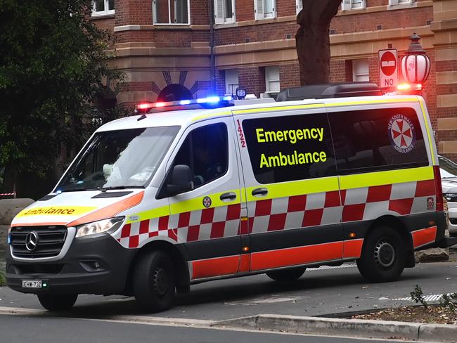 SYDNEY, AUSTRALIA -TelegraphMarch 21, 2022: An ambulance leaves the RPA Hospital as paramedics begin industrial action . Picture:  Jeremy Piper