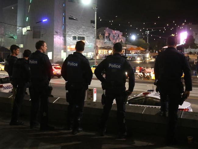 Police at Swanston St after the Moomba brawls. Picture: Yuri Kouzmin