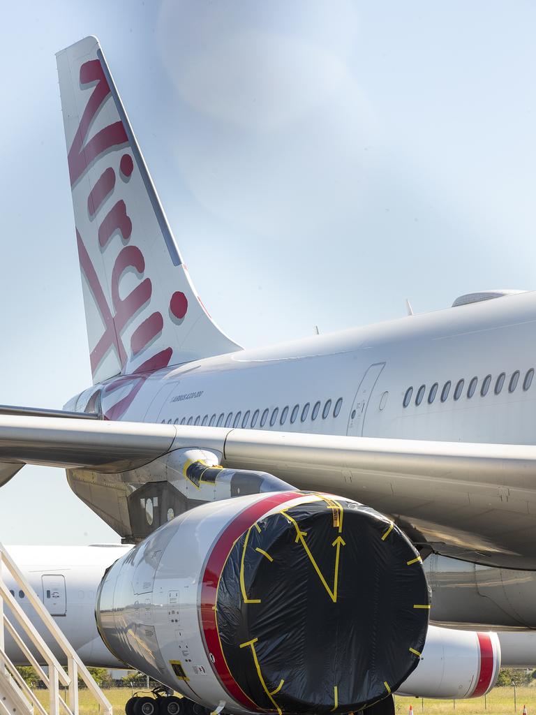 A grounded Virgin planeat Brisbane Airport. Picture: Jono Searle/Getty Images