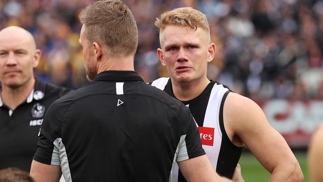 Adam Treloar and Nathan Buckley embrace after losing the 2018 AFL Grand Final. Picture: Phil Hillyard