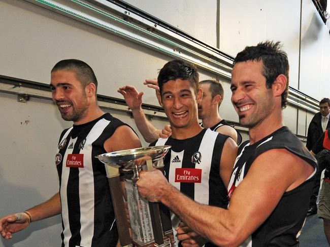 Didak holding the 2010 ANZAC Day trophy.