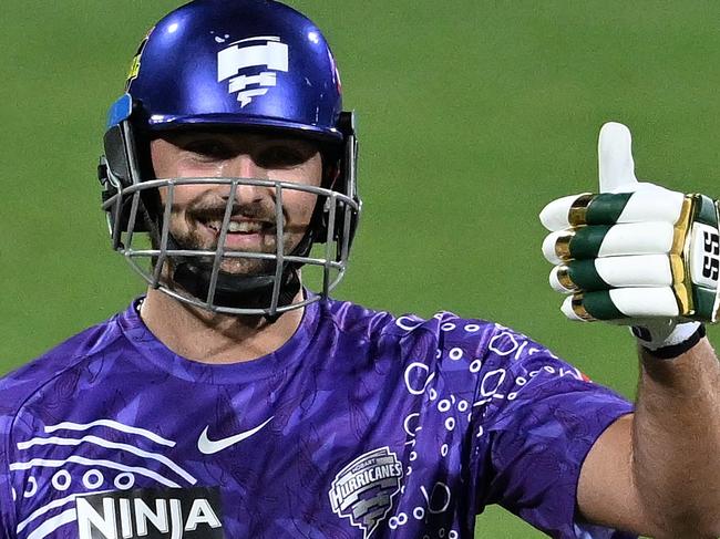 HOBART, AUSTRALIA - JANUARY 05: Tim David of the Hurricanes celebrates scoring a half century during the BBL match between the Hobart Hurricanes and Adelaide Strikers at Blundstone Arena, on January 05, 2025, in Hobart, Australia. (Photo by Steve Bell/Getty Images)