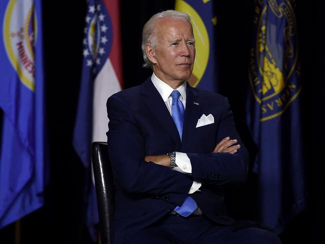 Joe Biden listens Kamala Harris. Picture: AFP