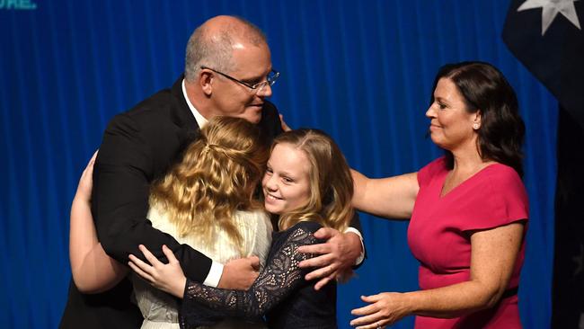 Australia's Prime Minister Scott Morrison hugs his daughters Abbey and Lily with wife Jenny Morrison after the Liberal Party's campaign launch in Melbourne. Picture: William West