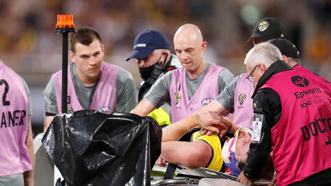 Nick Vlastuin left the field on a stretcher after being floored. Picture: Michael Willson/AFL Photos/Getty Images