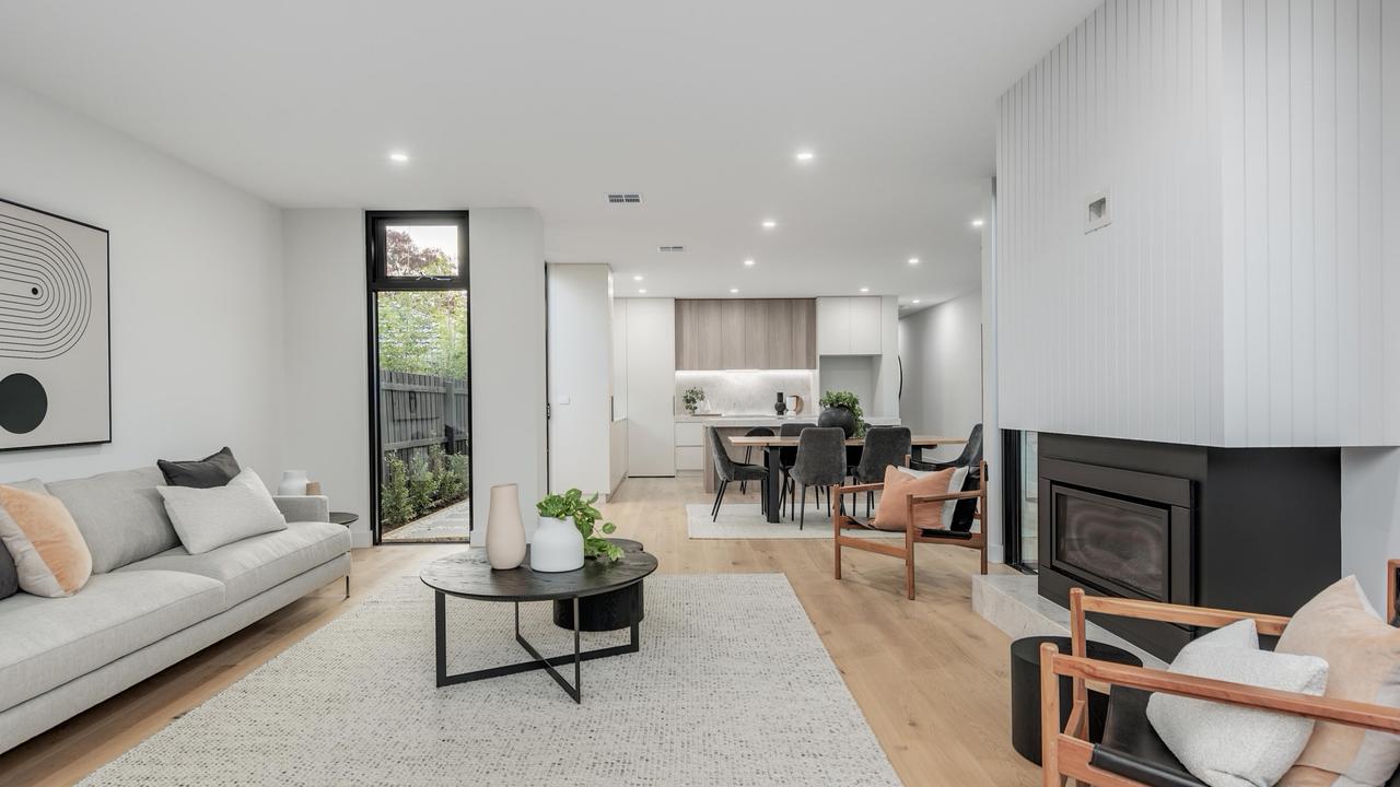 Large living space with fireplace.