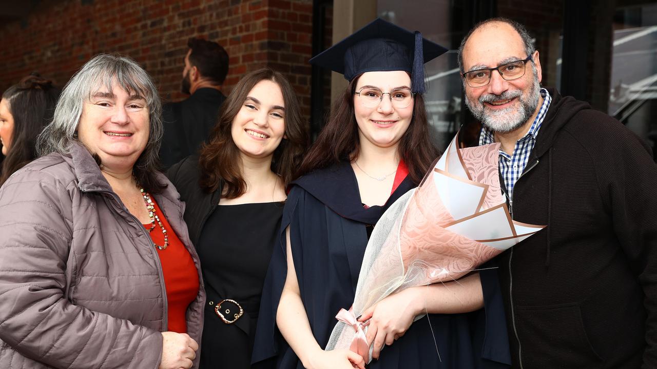 Deakin graduate Jodie Fox with mum Geraldene, sister Kayla and dad Michael. Picture: Alison Wynd