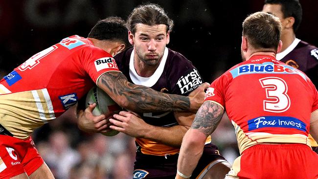 BRISBANE, AUSTRALIA - JULY 01: Patrick Carrigan of the Broncos takes on the defence during the round 18 NRL match between Brisbane Broncos and Dolphins at The Gabba on July 01, 2023 in Brisbane, Australia. (Photo by Bradley Kanaris/Getty Images)