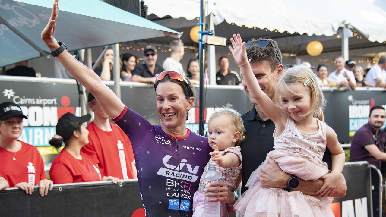 Cairns Iron Man - Womens Pro Winner second place getter Radka Kahlefeldt isn greeted by her children and husband as she crosses the finish . (First Triathlon since last giving birth !) Picture: Brian Cassey