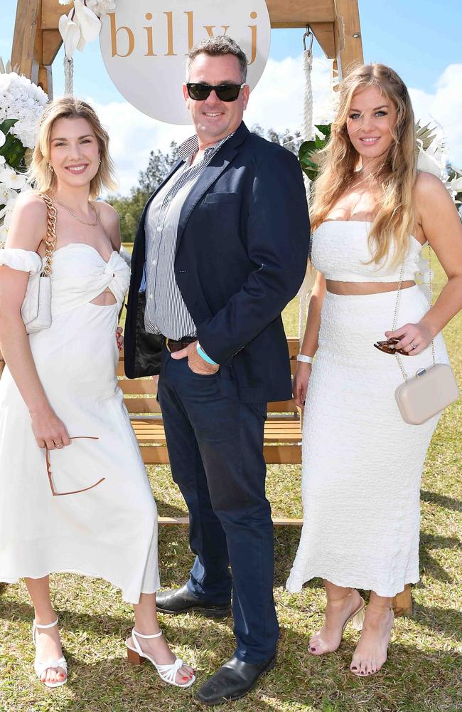 Elle lee and Ana Turvey with Will Richards at Coastline BMW Polo by the Sea. Picture: Patrick Woods.