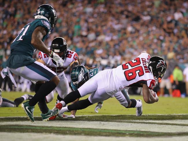 Tevin Coleman crashes over for the Falcons’ only touchdown. Picture: Getty