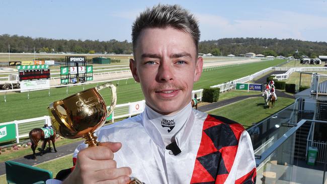 Melbourne Cup winning jockey Robbie Dolan with the Cup trophy at the Ipswich Turf Club, Bundamba. Picture: Liam Kidston