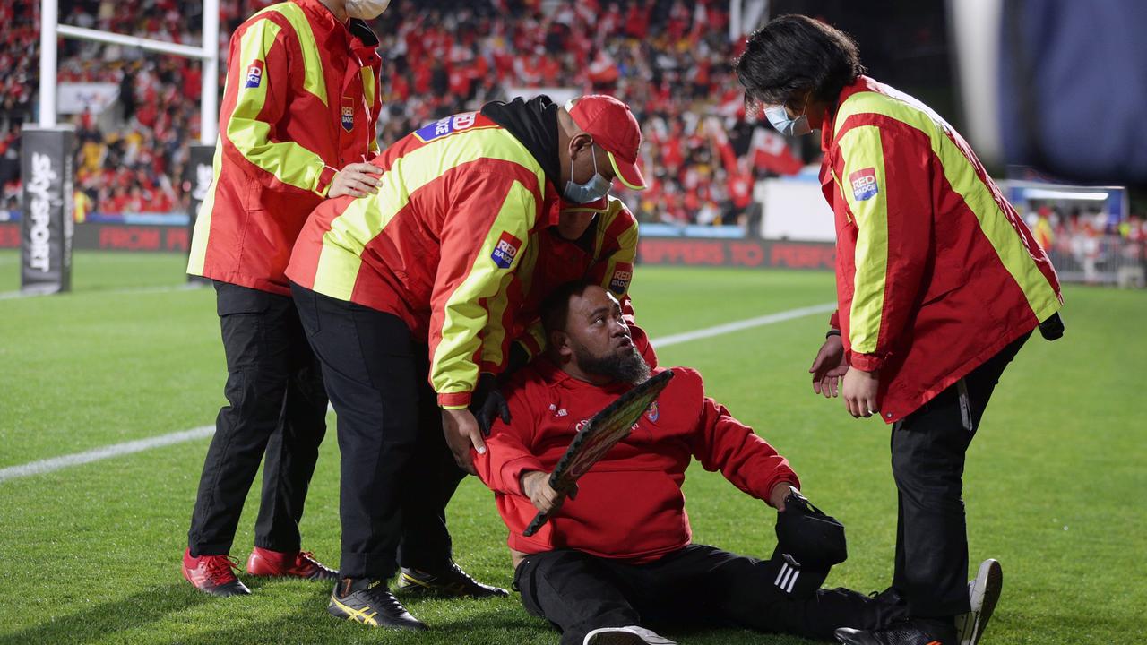 A pitch invader gets dealt with at the New Zealand vs Tonga game. (Photo by Dave Rowland/Getty Images)