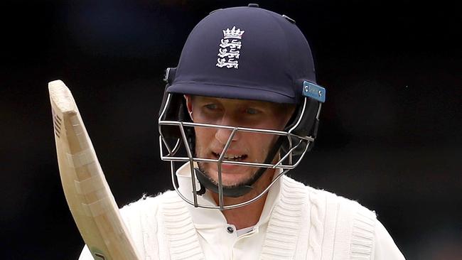 Joe Root of England looks dejected after being dismissed by Pat Cummins.