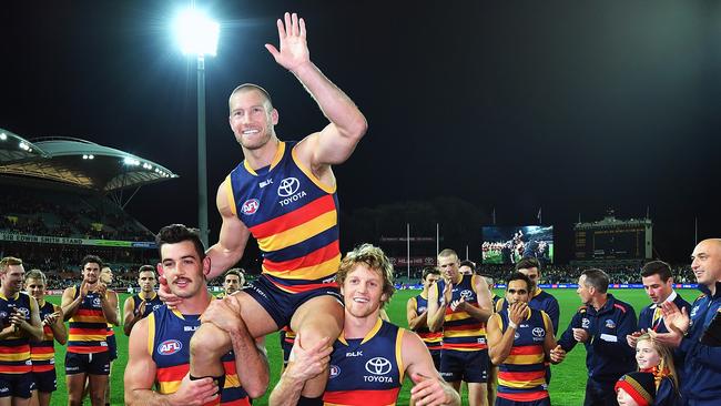 Scott Thompson is chaired off after his 300th AFL game by his Adelaide Crows.