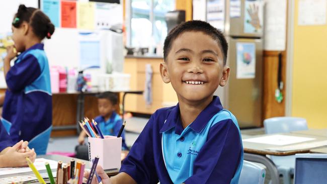 Parramatta State School prep student Than Thoo does some colouring in on the first day of school for 2025. Picture: Brendan Radke