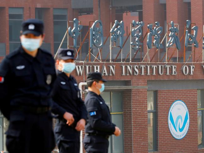 EMBARGO FOR TWAM 29 JUL 2023. FEE MAY APPLY FILE PHOTO: Security personnel keep watch outside the Wuhan Institute of Virology during the visit by the World Health Organization (WHO) team tasked with investigating the origins of the coronavirus disease (COVID-19), inÃÂ Wuhan, Hubei province, China February 3, 2021. REUTERS/Thomas Peter/File Photo