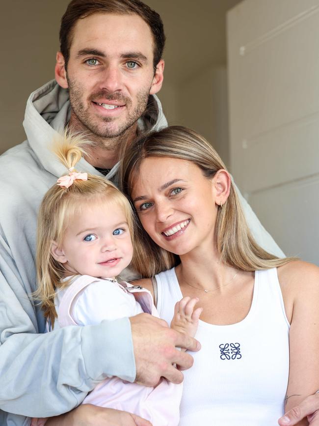 Kellie Finlayson with husband Jeremy and daughter Sophia. Picture: Russell Millard