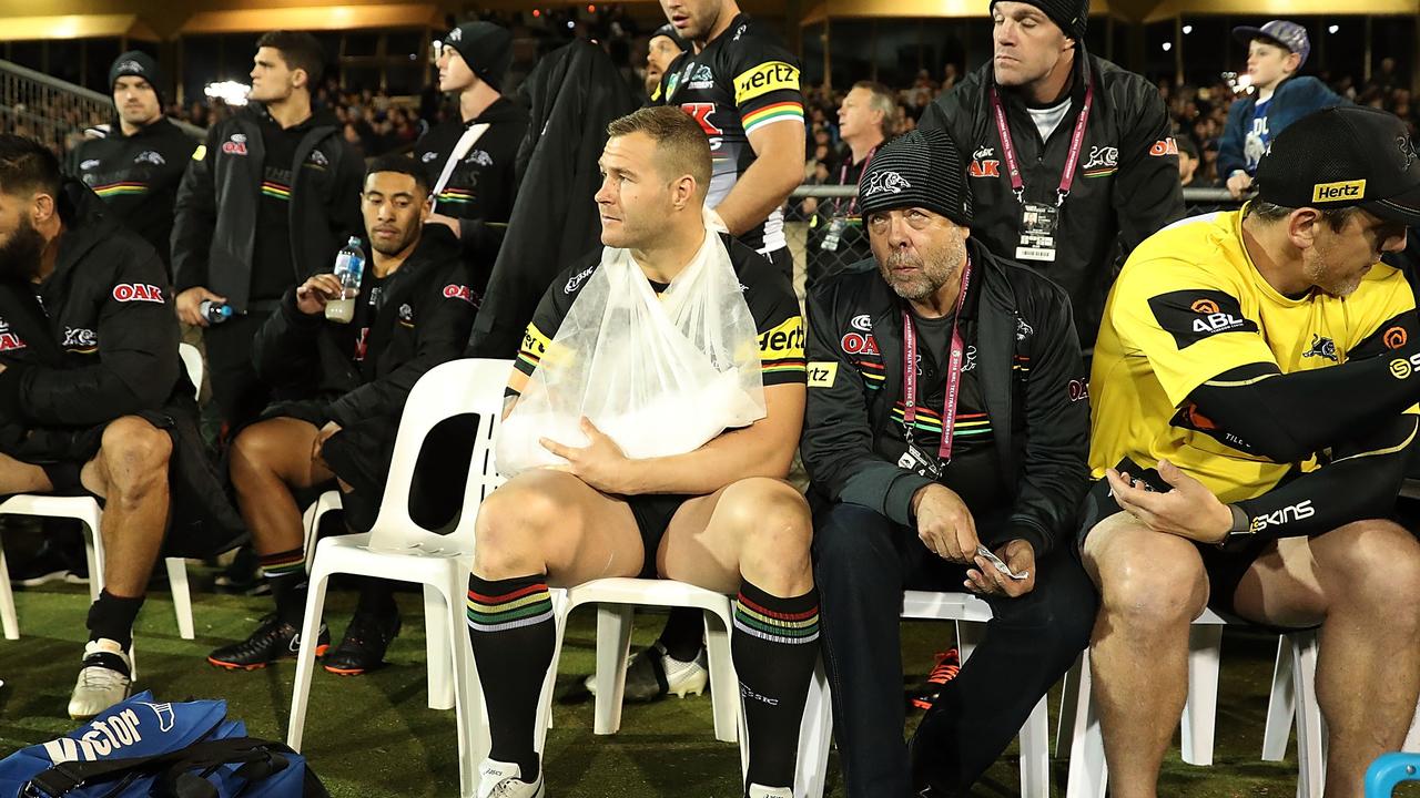 Trent Merrin of the Panthers sits on the sideline.