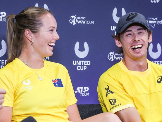 Alex de Minaur (R) shares a laugh with teammate Olivia Gadecki (C) ahead of the start of the United Cup.