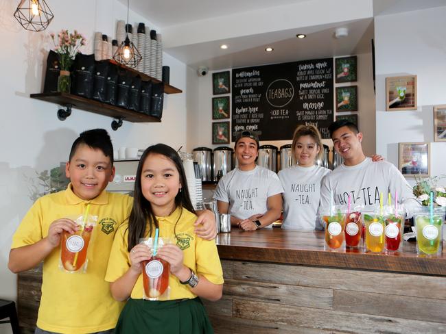 Vince, 11, and Lily Ho, 9, with staff Tuan Tran, Nhi Ho and Johnny Dang.