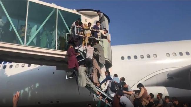 Scene at Kabul airport as civilians try to board planes. Picture: Twitter/Ahmer Khan