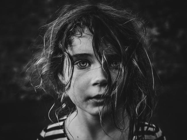 Overall winner and portrait winner: Helen Whittle ... Helen Whittle’s portraits of her seven-year-old daughter Minnie are at first strikingly simple, yet contain a complexity of emotion that only comes from the closest of relationships between a photographer and their sitter. The runner-up in the Portrait category last year, Whittle’s images are all taken with natural light, and capture the quiet, sensitive and intense side of Minnie’s personality, something Whittle says she rarely catches glimpses of. Picture: Helen Whittle/Australian Photography magazine