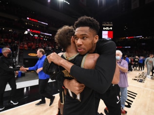 ATLANTA, GA - JULY 3: Giannis Antetokounmpo #34 of the Milwaukee Bucks hugs Trae Young #11 of the Atlanta Hawks after the game during Game 6 of the Eastern Conference Finals of the 2021 NBA Playoffs on July 3, 2021 at State Farm Arena in Atlanta, Georgia.  NOTE TO USER: User expressly acknowledges and agrees that, by downloading and/or using this Photograph, user is consenting to the terms and conditions of the Getty Images License Agreement. Mandatory Copyright Notice: Copyright 2021 NBAE (Photo by David Dow/NBAE via Getty Images)