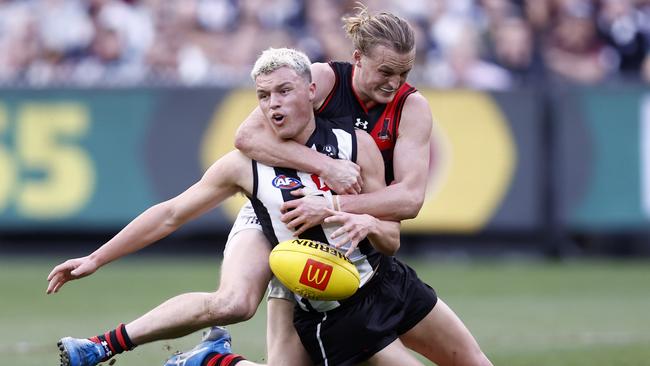 Mason Redman tackles Jack Ginnivan. Picture: Darrian Traynor/Getty Images