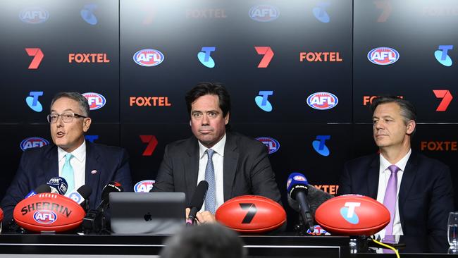 Foxtel chief executive Patrick Delaney, AFL chief executive Gillon McLachlan and Seven Network chief executive James Warburton announce the new TV deal. Picture: Getty Images