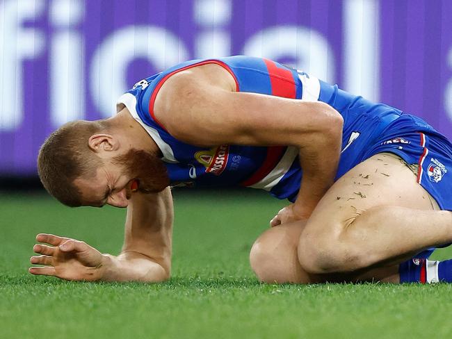 MELBOURNE, AUSTRALIA - JUNE 18: Liam Jones of the Bulldogs lays injured during the 2023 AFL Round 14 match between the North Melbourne Kangaroos and the Western Bulldogs at Marvel Stadium on June 18, 2023 in Melbourne, Australia. (Photo by Michael Willson/AFL Photos via Getty Images)