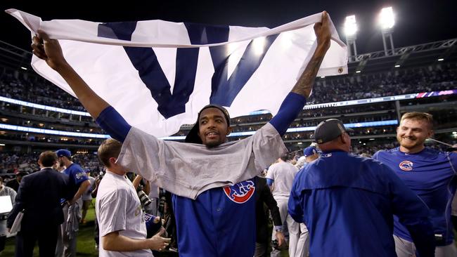 Carl Edwards celebrates after defeating the Cleveland Indians 8-7 in Game 7.